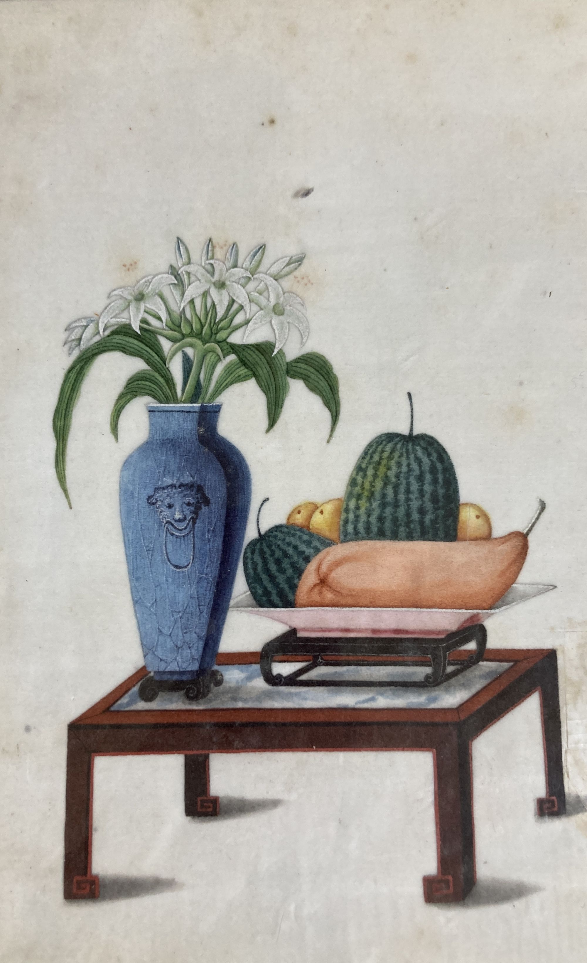19th century Chinese School, pair of gouache on pith paper, Still lifes of fruit and flower vases on tables, 26 x 17cm
